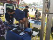 Alec, Christopher, Thomas, and Tim setting up the booth on Saturday morning