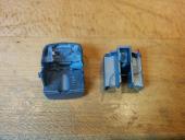 The state of the two light pipe brackets after the front headlight light pipe snapped.